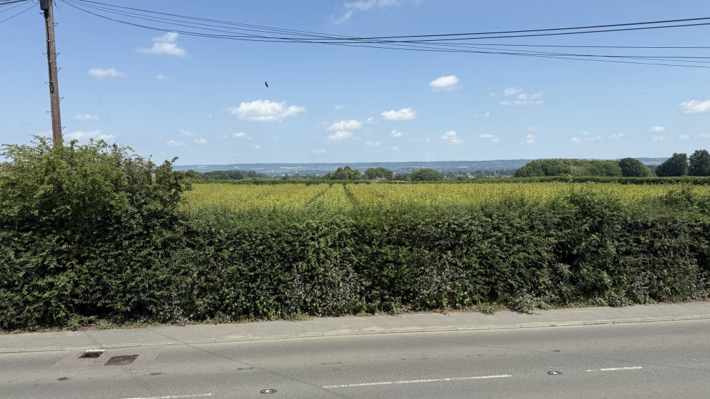 Lot: 104 - FIRST FLOOR TWO-BEDROOM MAISONETTE WITH BALCONY GARDEN AND PARKING - Image from bedroom window overlooking countryside